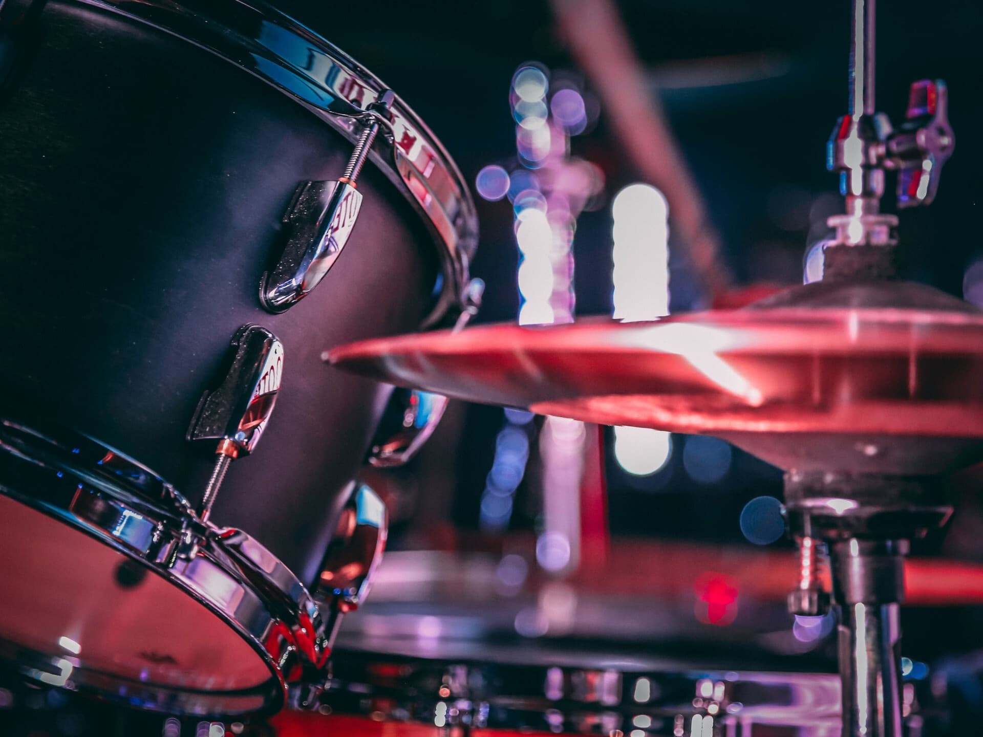 Black acoustic drum set with shiny hi hat